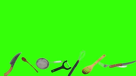Collage of kitchen utensils falling against a vibrant green background Stock Footage 338318589
