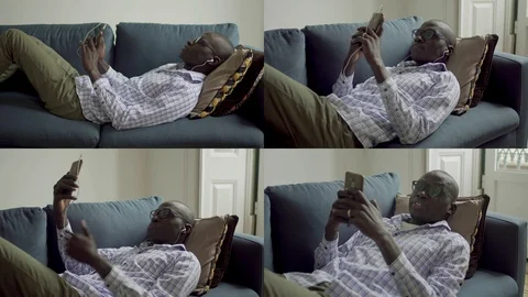 Collage of man lying indoor, texting, having video chat on phone Stock Footage 110507441