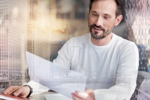 Collage of pleasant man checking documents against urban background Stock Photos