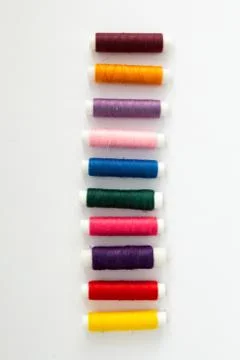 Collage of threads for sewing different colors Stock Photos