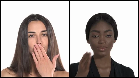 Collage of two charming young multiracial women sending air kisses. Body Stock Footage 129393959