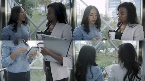 Collage of two colleagues discussing project in elevator Stock Footage 106194115