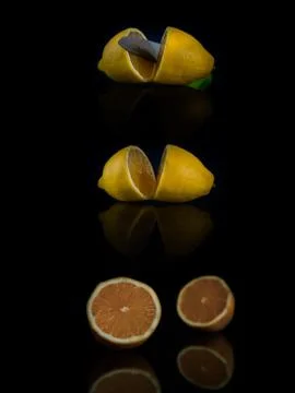 Collage two halves of lemon cut with a knife on a black background Stock Photos