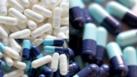 Collage of white and blue capsules rotate, top view. Stock Footage 154629982