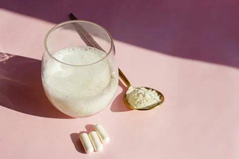 Collagen or protein powder in a glass Stock Photos