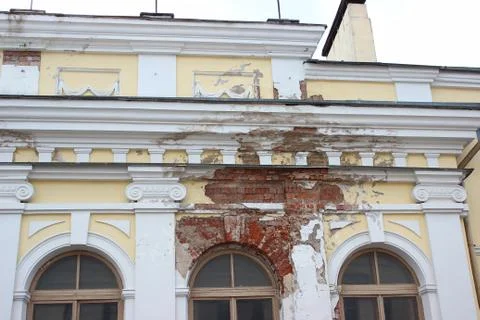 The collapse of the plaster from the wall, the destruction of the building. b Stock Photos