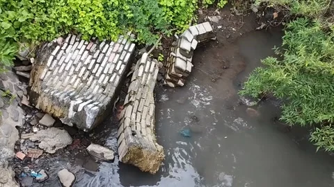 Collapse of the wall of the restaurant by the river Stock Footage 225486701