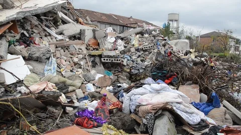 Collapsed and destroyed building after earthquake, closeup. Debris. Demolished Stock Footage 122385870