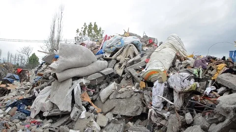 Collapsed and destroyed building after earthquake. Remains of a damaged houses Stock Footage 122435377