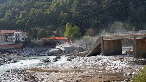 Collapsed bridge due to bad weather at romagnano sesia, zoom out Stock Footage 279908675