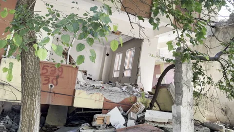 Collapsed building. It's leaning to the right. A room in the destroyed building. Stock Footage 246421410