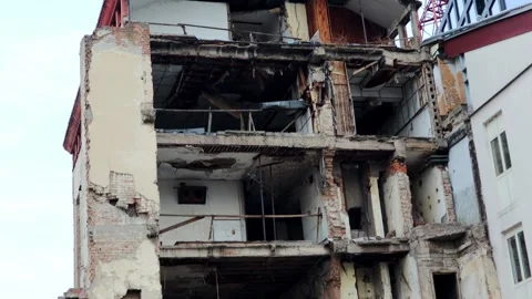 The collapsed building of the RTS during the NATO bombing. Side shot Stock Footage 296482049