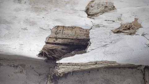 The collapsed ceiling of an old house. Stock Photos