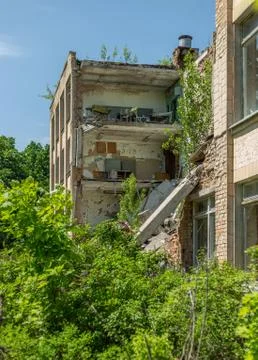 Collapsed facade of the school building Stock Photos
