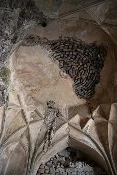 Collapsed historic dome ceiling with intricate medieval architecture and we.. Stock Photos