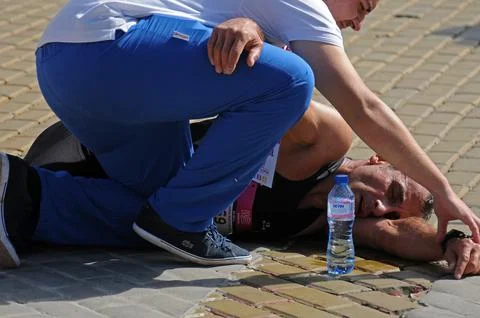 Collapsed marathon runner Stock Photos