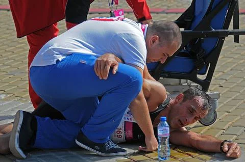 Collapsed marathon runner Stock Photos