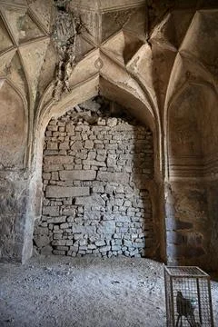 Collapsed medieval stone arch with damaged vaulted ceiling inside ancient f.. Stock Photos
