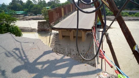 Collapsed road after continuous rain and flood in India Stock Footage 321039802