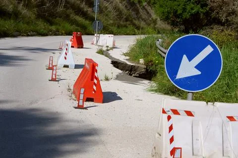 Collapsed road...road block has collapsed. Stock Photos