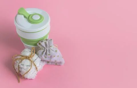 Collapsible silicone mug, mesh bag and reusable cotton discs set Stock Photos