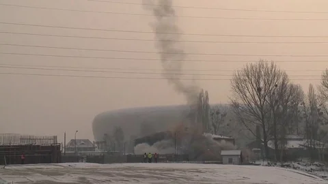 Collapsing factory chimney after controlled demolition Stock Footage 69125222
