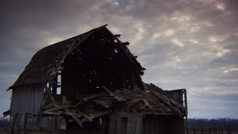 Collapsing hay barn on a haunting and gray autumn day. Stock Footage 240376609