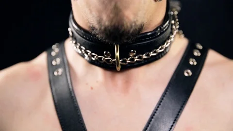 Collared person on leash 스톡 동영상 105771755