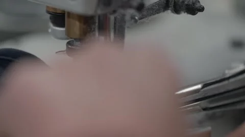 Collarette sewing machine attaching elastic band to fabric Stock Footage 331982845