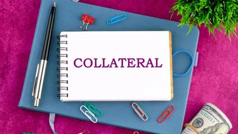 COLLATERAL text written on a blank sheet of notepad in a composition with pen Fotos Stock