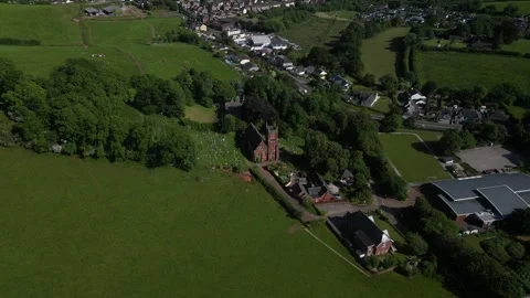 Collaton St Mary, South Devon, England: DRONE VIEWS: St Mary Church and village Stock Footage 242486358