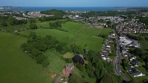 Collaton St Mary, South Devon, England: DRONE VIEWS: The village and Totnes Road Stock Footage 242488709
