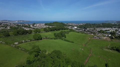 Collaton St Mary, South Devon, England: DRONE VIEWS: St Mary Church and village Stock Footage 242489216