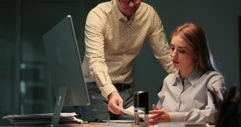 Colleague shows reports with wrong data to lady boss Stock Footage 280601001