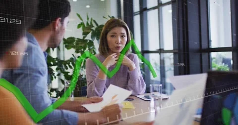 Colleague sliding report across table teammate analyzing business data with Stock Footage 327845229