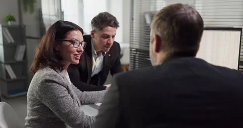 Colleagues analyzing financial data on desktop computer during office Stock Footage 331529161