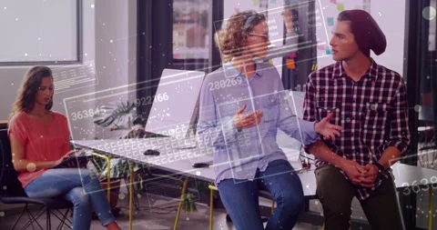 Colleagues analyzing tech data in open-plan office, integrating interactive Stock Footage 308654193