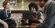 Colleagues And Clients Talking Strategy With Laptop And Tablet.group Of Stock Footage