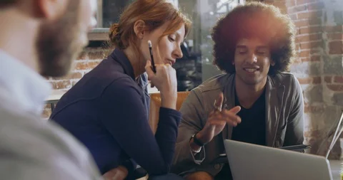 Colleagues and clients talking strategy with laptop and tablet.Group of Stock-Footage 101541158