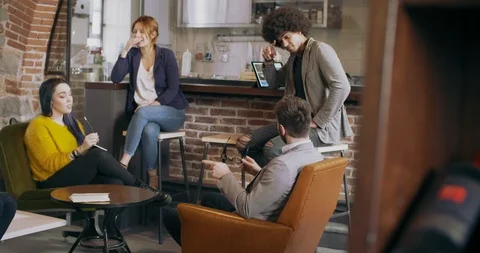 Colleagues and clients talking strategy in dining area.Group of multiethnic 動画素材 126228705