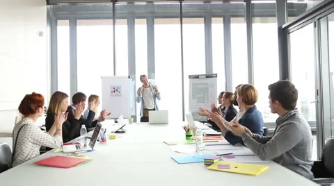 Colleagues applauding creative director during a meeting Stock Footage 59544061