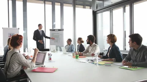 Colleagues applauding director during a meeting in conference room Stock Footage 59543953