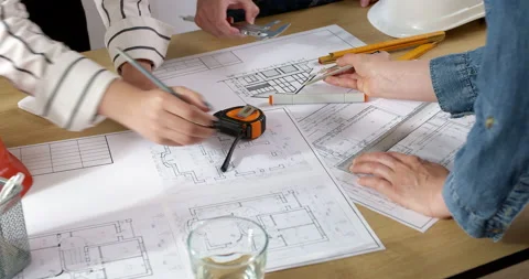 Colleagues architects are working on a construction project.  Stock Footage 210180216