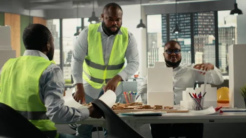 Colleagues in architecture working together on project design and development Stock Footage 322139691