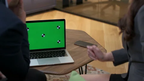 Colleagues are discussing the project on a laptop. Business meeting offline. Stock Footage 231894428