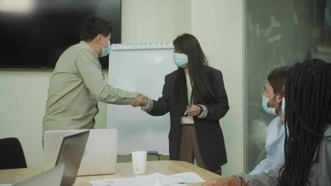 Colleagues are sharing hands during meeting Stock Footage 160627659