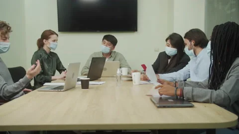 Colleagues are sitting together in the office room and resting Stock Footage 160629231