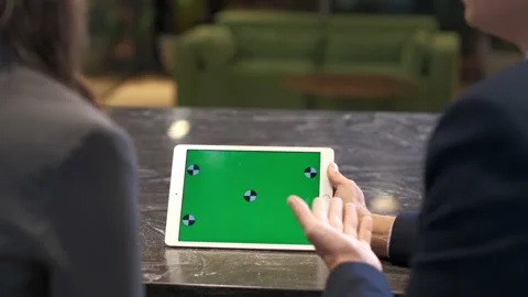 Colleagues argue over the information on the tablet, green screen, close-up Stock Footage 232097083
