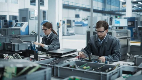 Colleagues Assembling Computers At Electronics Factory Stock Footage 260477909