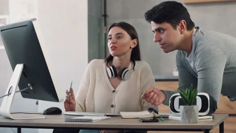 Colleagues brainstorming and discussing a project. Team working together in Stock Footage 152040222
